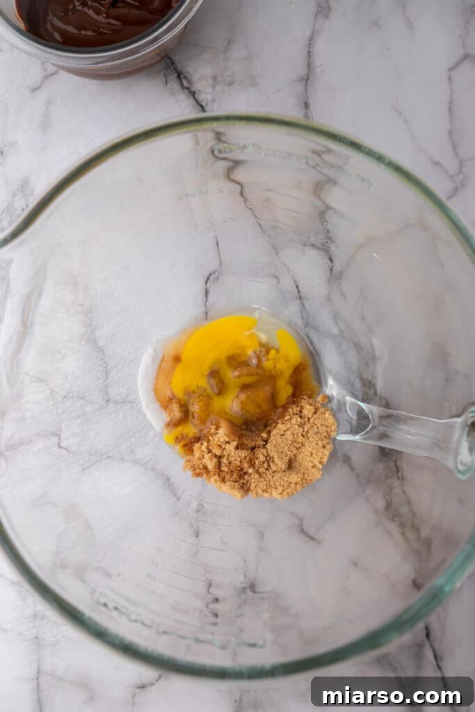 Wet ingredients in a bowl before mixing.