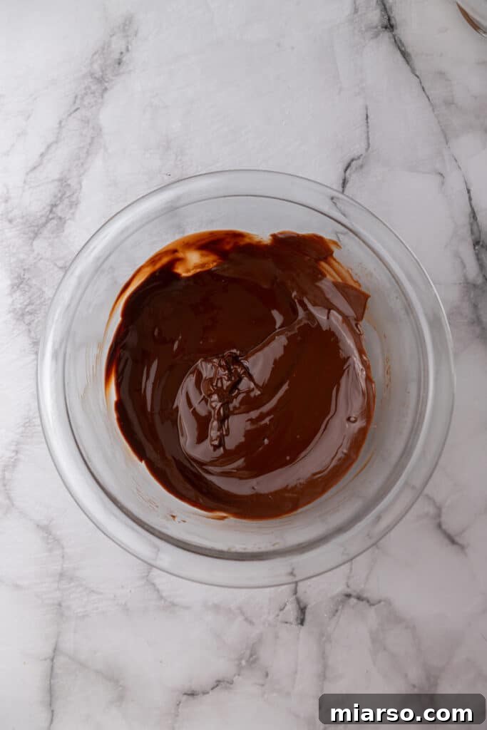 Melted chocolate and butter in a bowl.