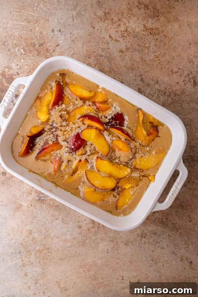 batter and fruit in a dish