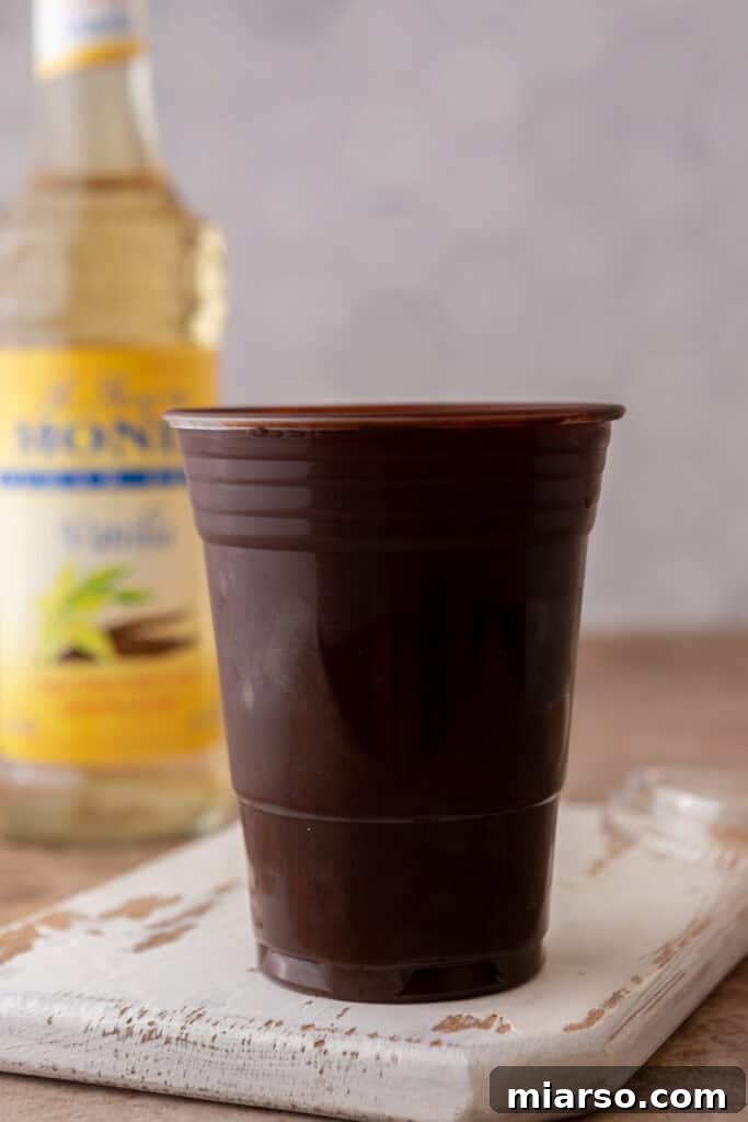Plastic cup coated in melted chocolate