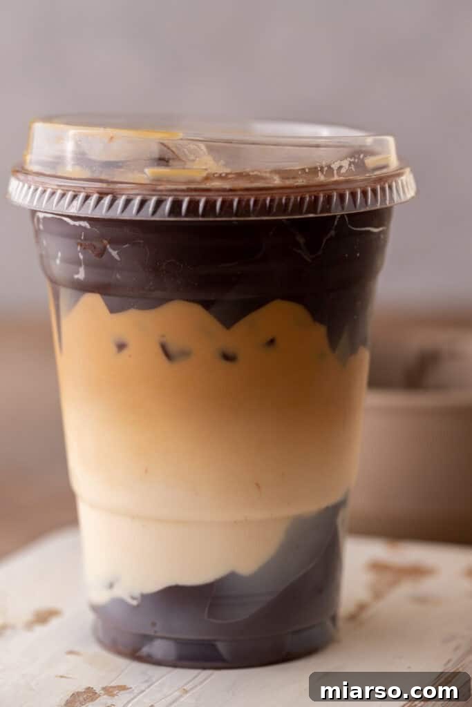 Close up of Tiktok Vital cracking latte