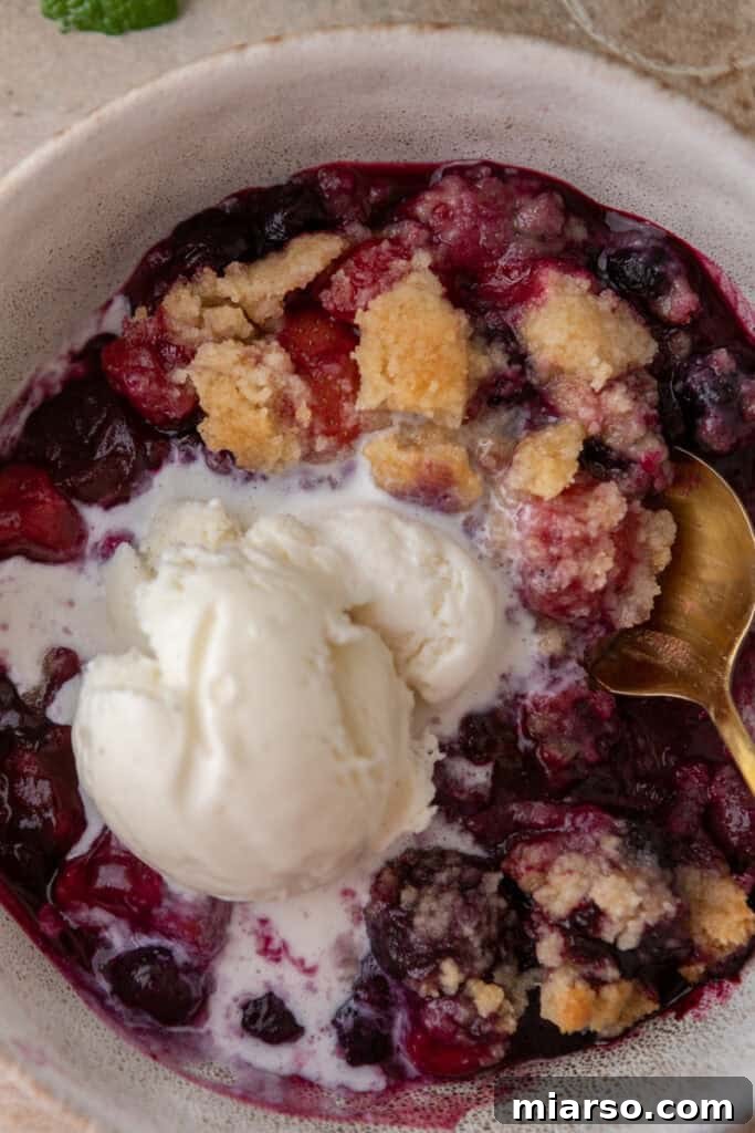 overhead shot of the mixed berry cobbler recipe in a bowl