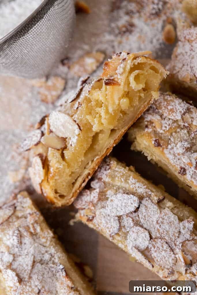 Close-up of golden brown strips of a Braided Almond Croissant Danish recipe