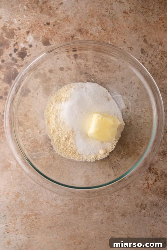 Softened butter and sugar for frangipane in a bowl