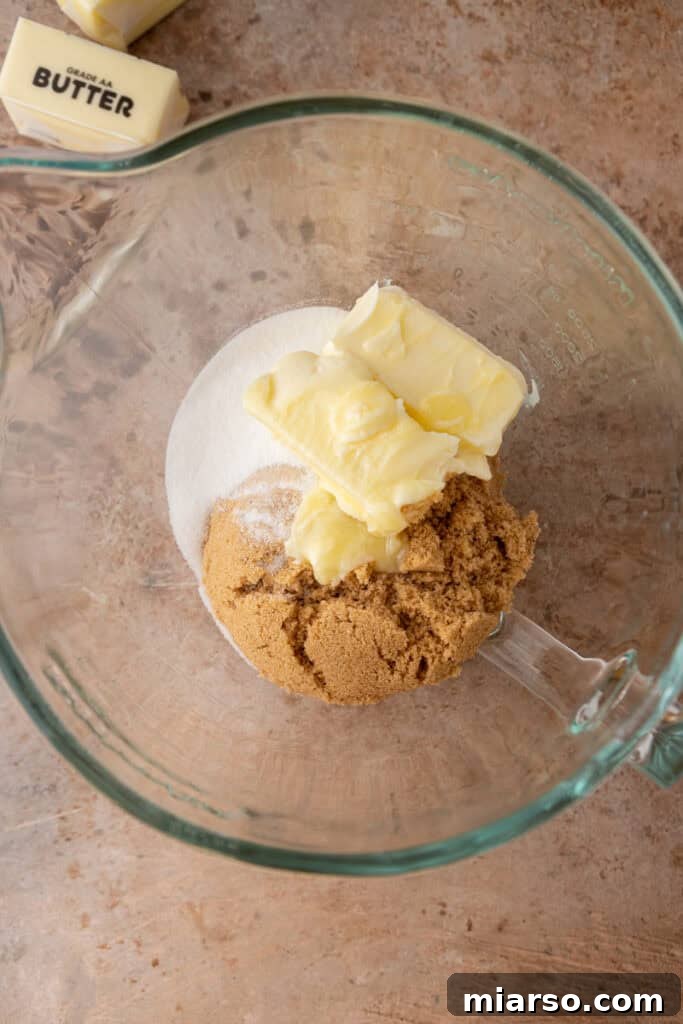 Creamed butter and sugar in a mixing bowl, showcasing the fluffy texture.