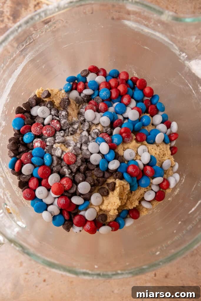 Red, white, and blue M&M's and chocolate chips waiting to be folded into cookie dough.