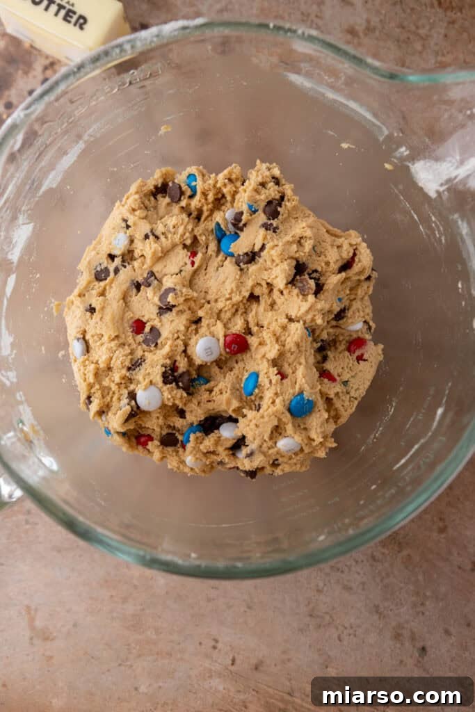 Ready-to-bake cookie dough in a mixing bowl after all ingredients are combined.