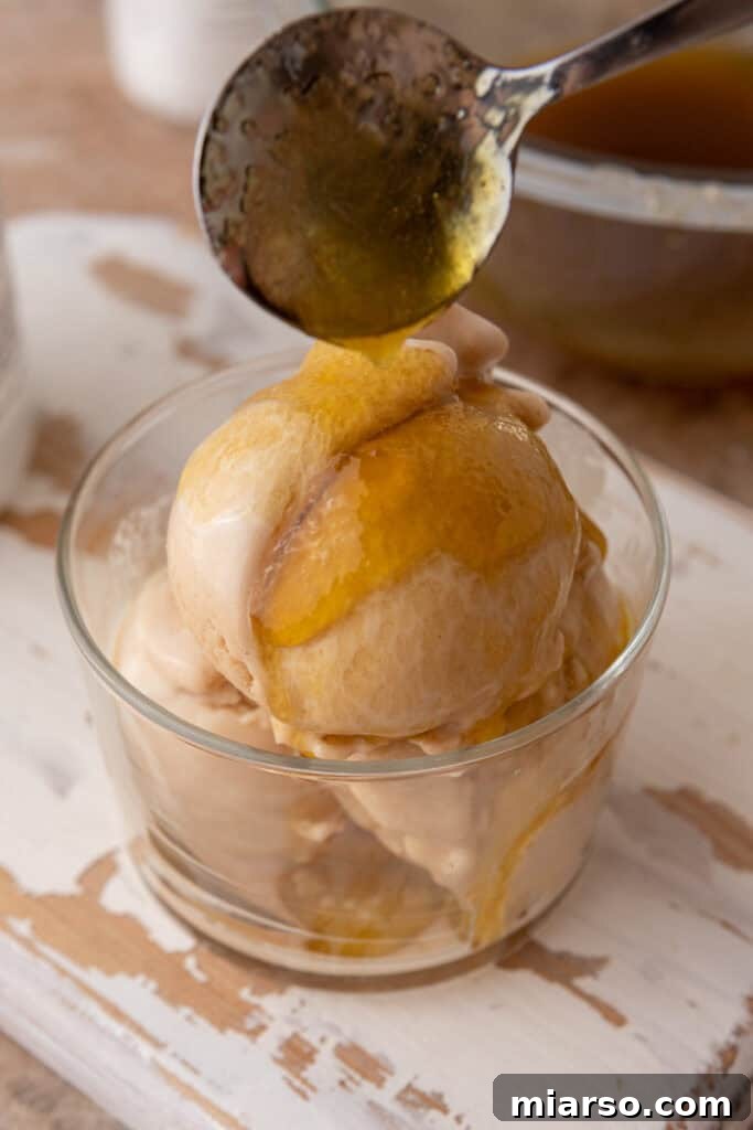 viral olive oil caramel recipe drizzled over ice cream