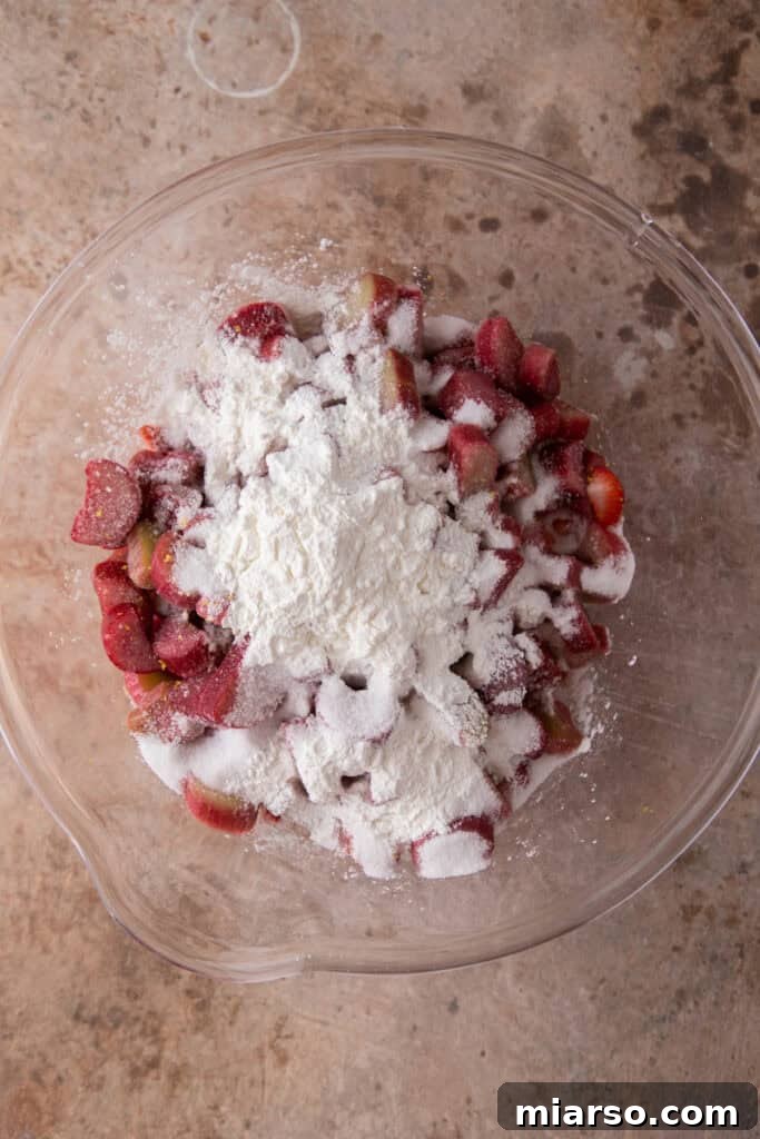 Your New Favorite Strawberry Rhubarb Crisp 8 Fresh hulled and quartered strawberries in a bowl.