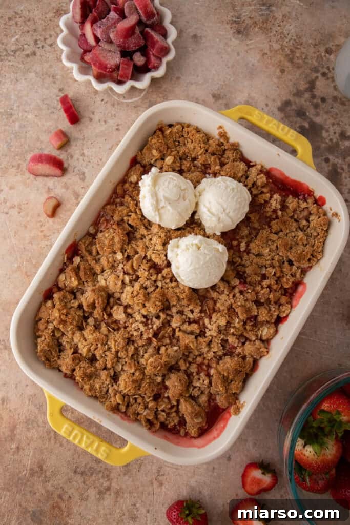 Your New Favorite Strawberry Rhubarb Crisp 10 A fully baked Strawberry Rhubarb Crisp, golden brown and bubbling, served with ice cream.