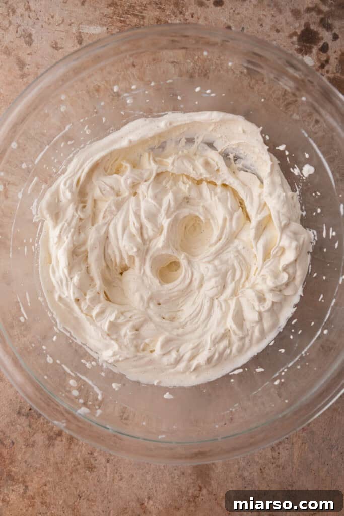 Effortless No-Churn Tiramisu Ice Cream 6 mixed ingredients in a bowl