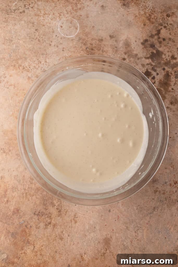 Effortless No-Churn Tiramisu Ice Cream 8 mixed ingredients in a bowl