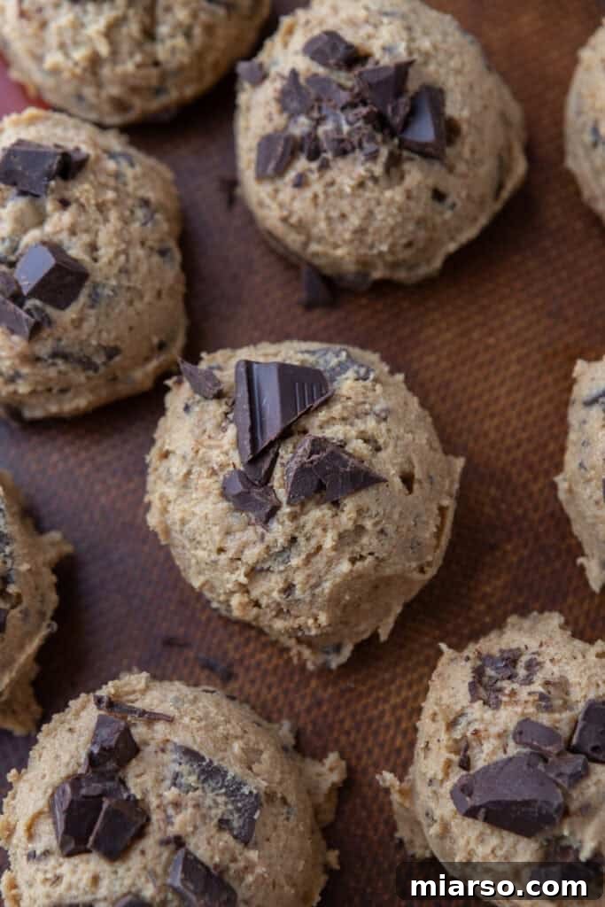 Scoops of cookie dough on a pan