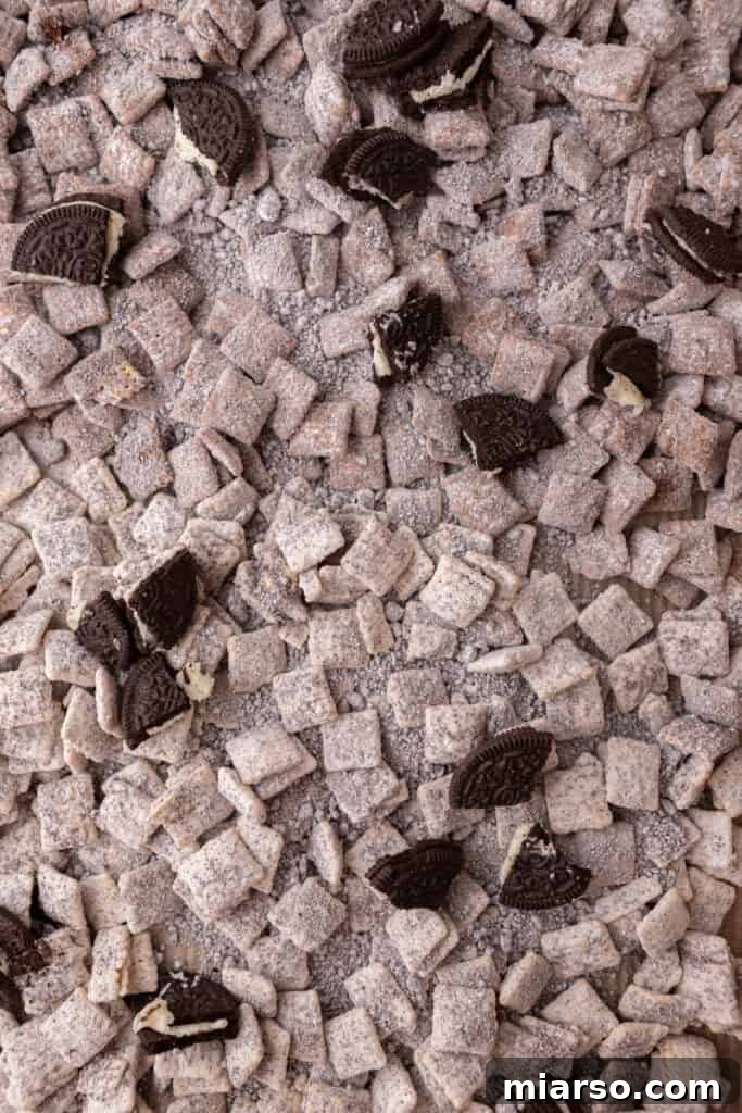 Close-up of Cookies and Cream Muddy Buddies, highlighting the crispy texture and cookie crumbs.