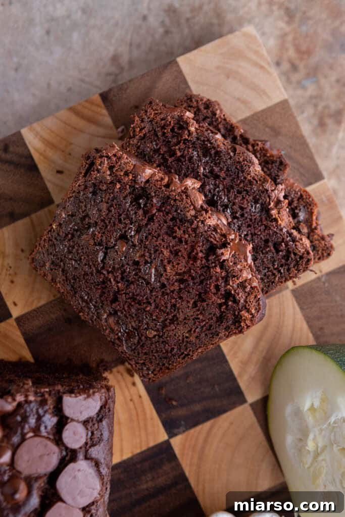 Decadent Double Chocolate Zucchini Loaf 12 Overhead view of several slices of Double Chocolate Zucchini Bread on a plate, ready to serve