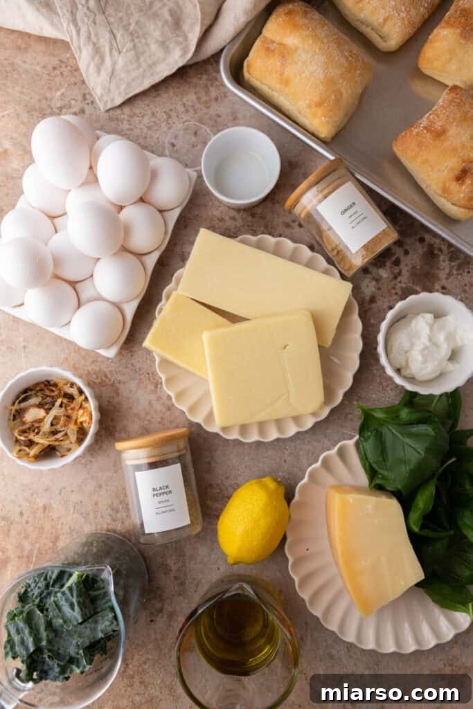 All the fresh ingredients laid out on a wooden board, ready for preparing the Starbucks Egg Kale Pesto Mozzarella Sandwich copycat recipe.