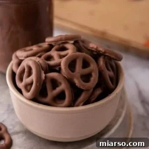A delicious bowl of homemade chocolate-covered pretzels, showcasing their perfect snack appeal.