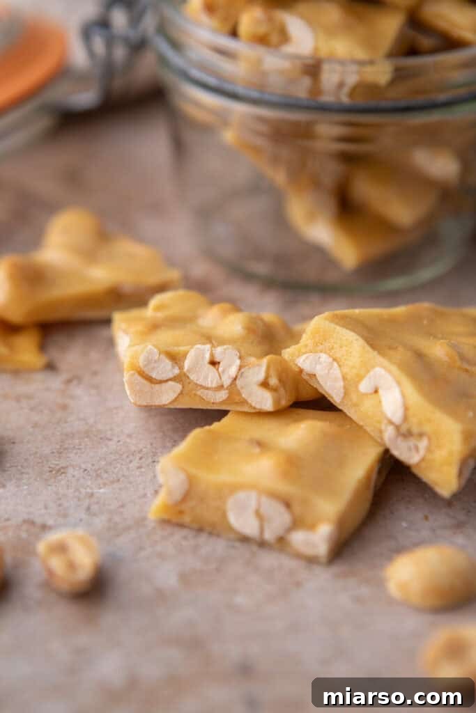 Crunchy pieces of Microwave Peanut Brittle, perfect for a homemade holiday treat.