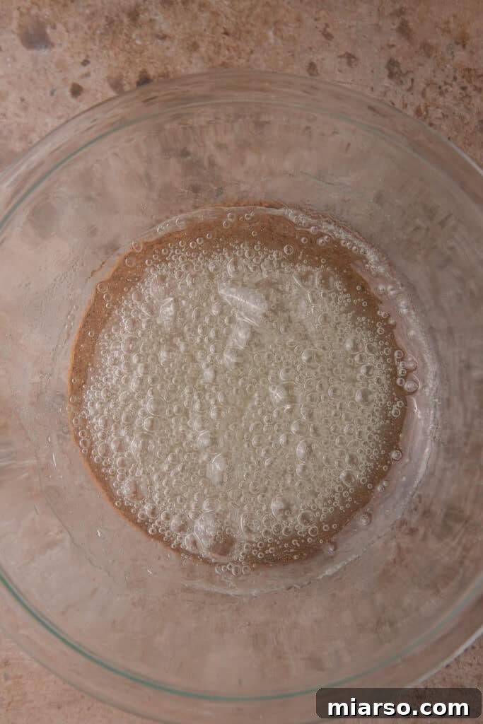 Sugar and corn syrup mixture after first microwave interval, golden and bubbling.