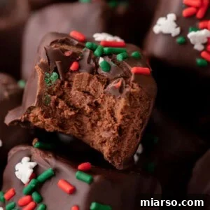 Effortless Three Musketeers Cool Whip Treats 14 Holiday cool whip candy topped with festive red and green sprinkles.