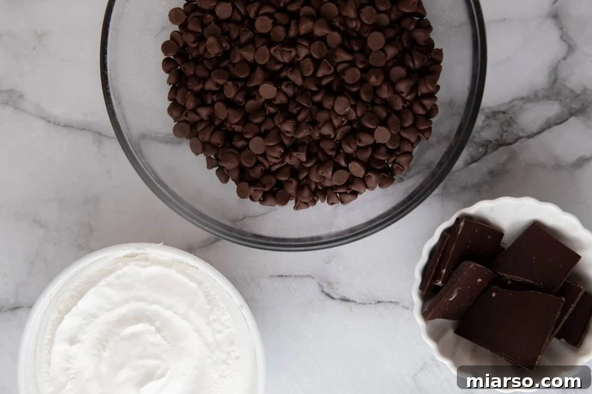 Effortless Three Musketeers Cool Whip Treats 3 Ingredients for cool whip candy including whipped topping, milk chocolate chips, and dark chocolate.