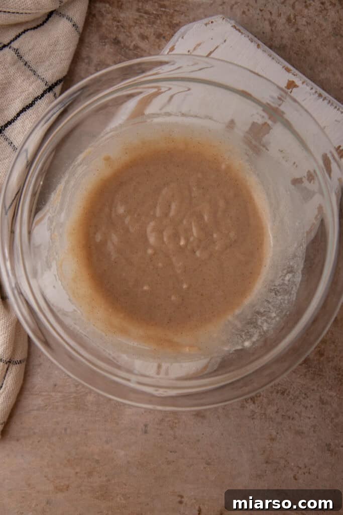 Mixed batter in a bowl for snickerdoodle mug cake