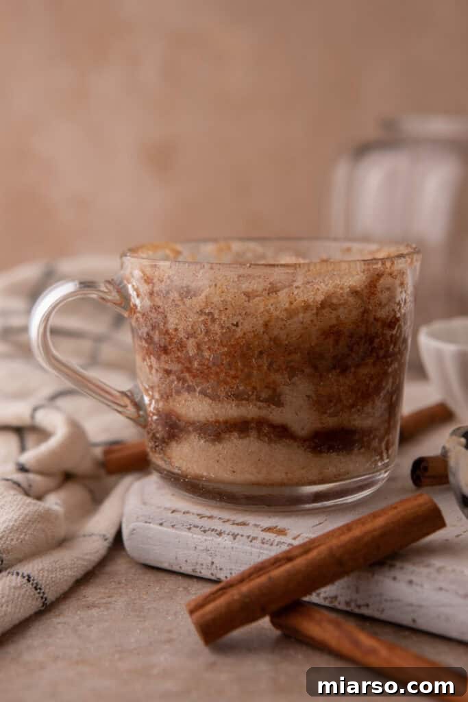 Fully cooked snickerdoodle mug cake in a cup, ready to serve