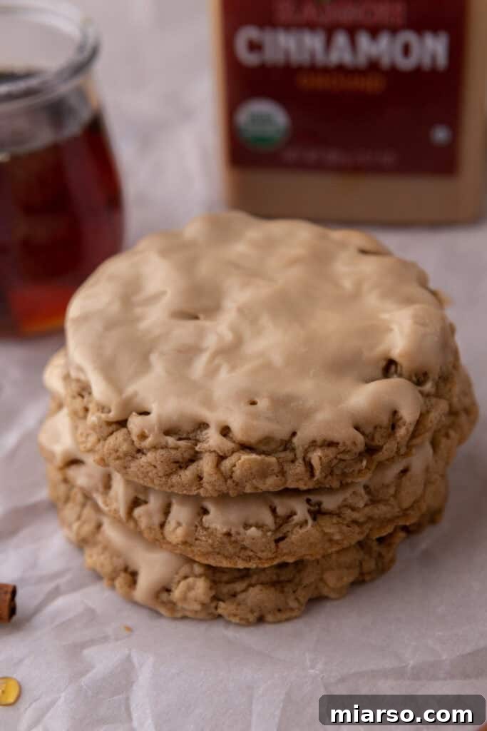 maple glazed oatmeal cookies stacked on top of each other