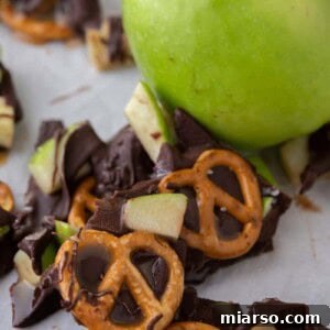 The Ultimate Caramel Apple Bark Recipe 12 caramel apple bark recipe next to an apple