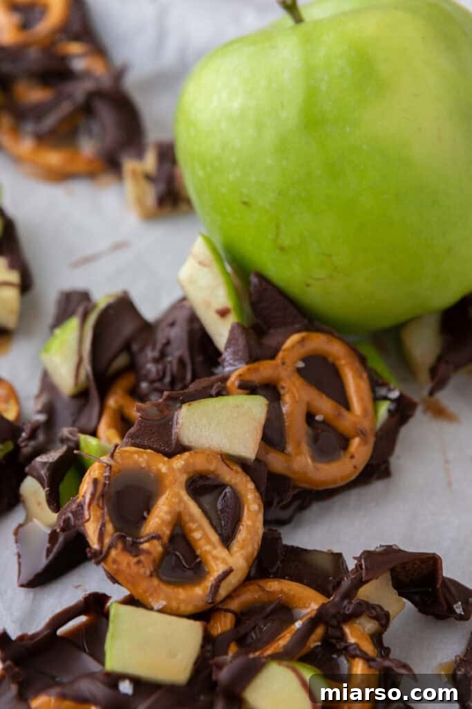 The Ultimate Caramel Apple Bark Recipe 9 caramel apple bark recipe next to an apple
