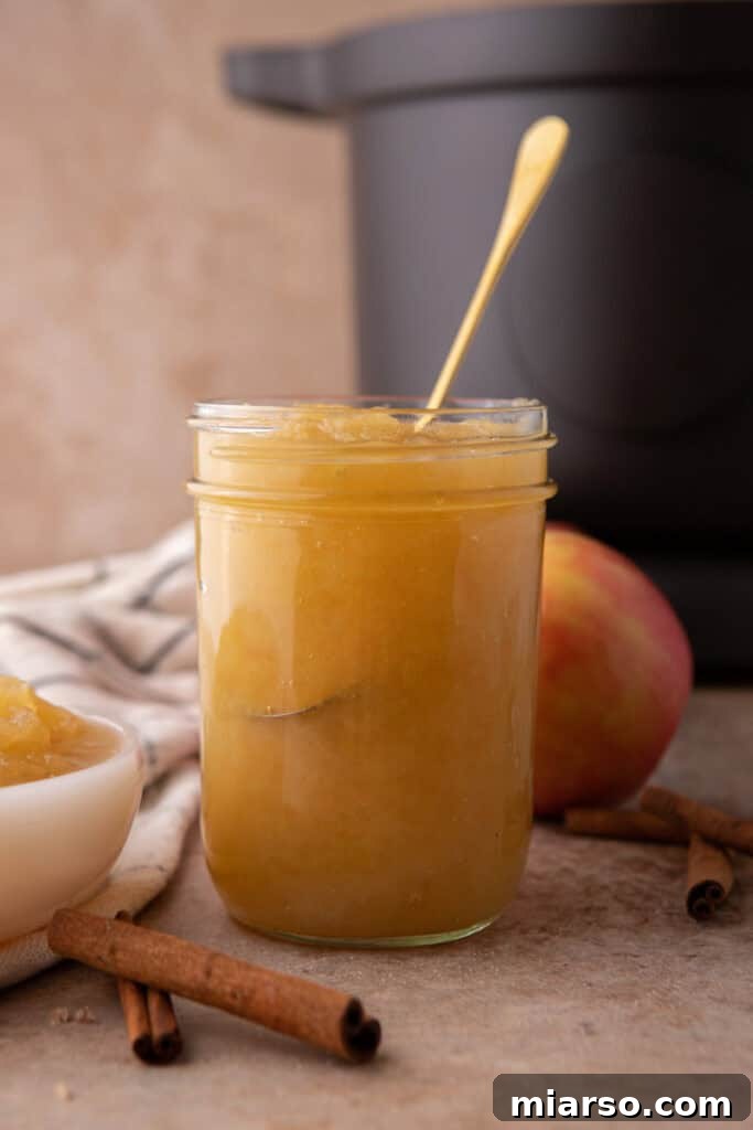 Effortless Instant Pot Applesauce Perfection 8 instant pot apple sauce in a jar side shot, with a cozy fall aesthetic