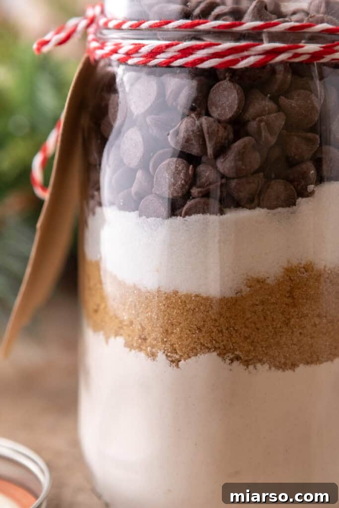 Chocolate Chip Cookie Mix in a Jar, tied with a ribbon, ready for gifting