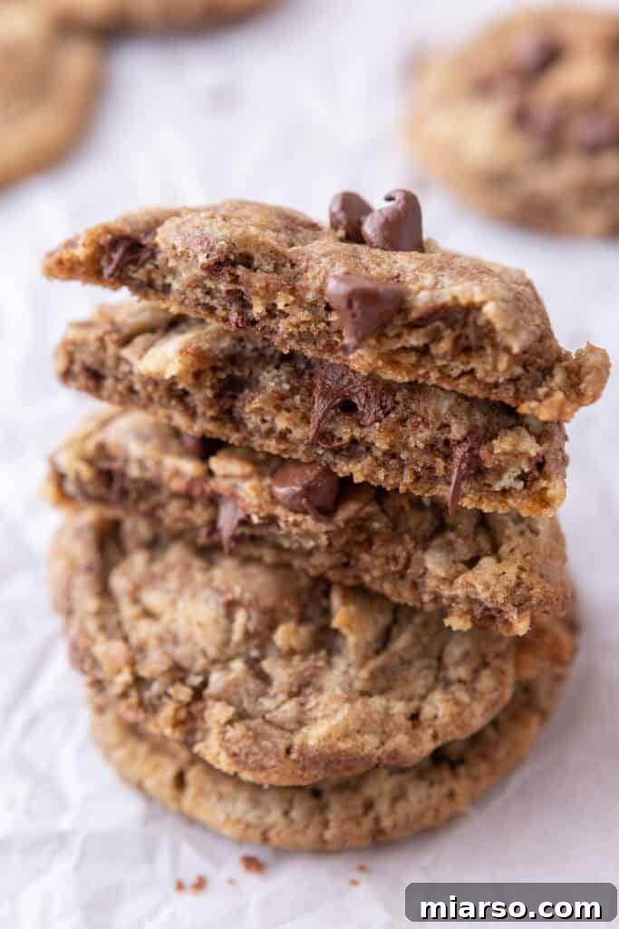 A stack of freshly baked chocolate chip cookies on a plate