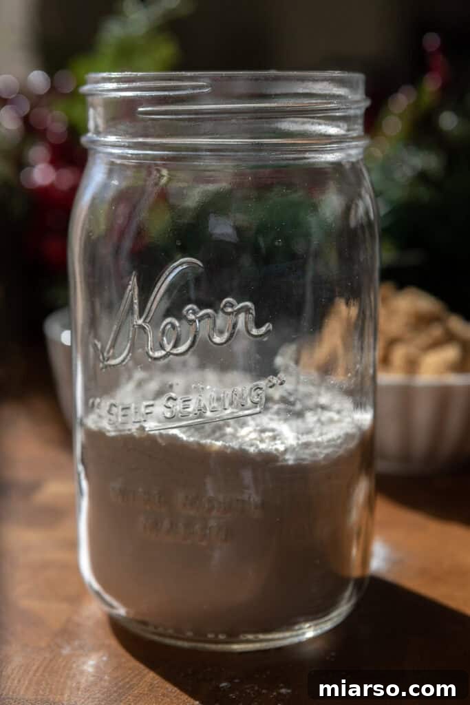 Layering flour into a jar for cookie mix