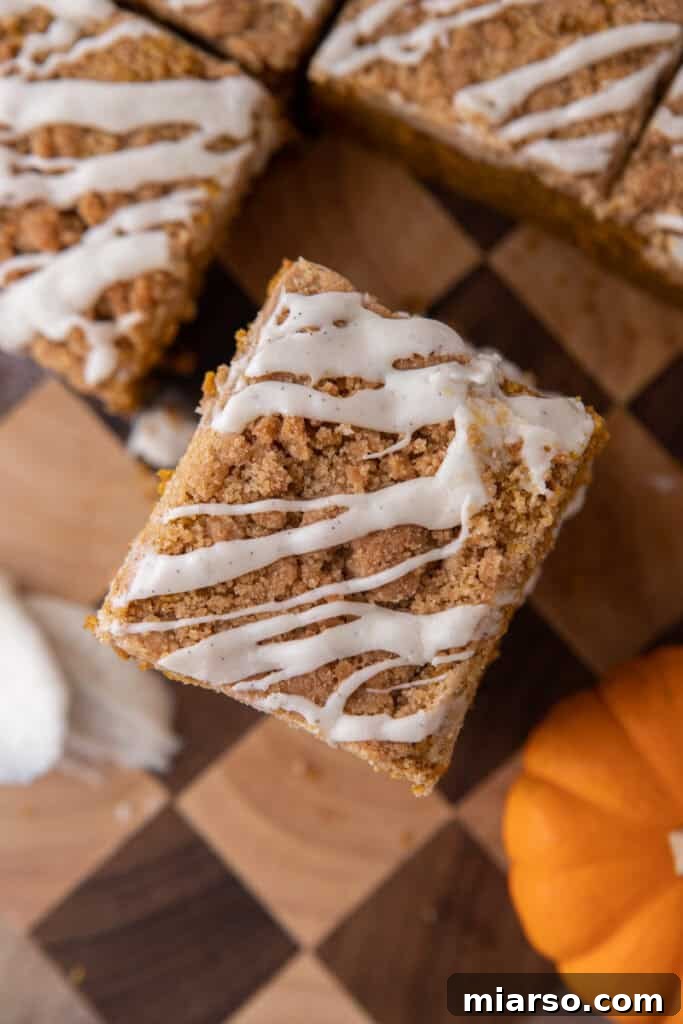 An inviting overhead shot of a freshly baked and glazed pumpkin coffee cake, ready to be shared and enjoyed.