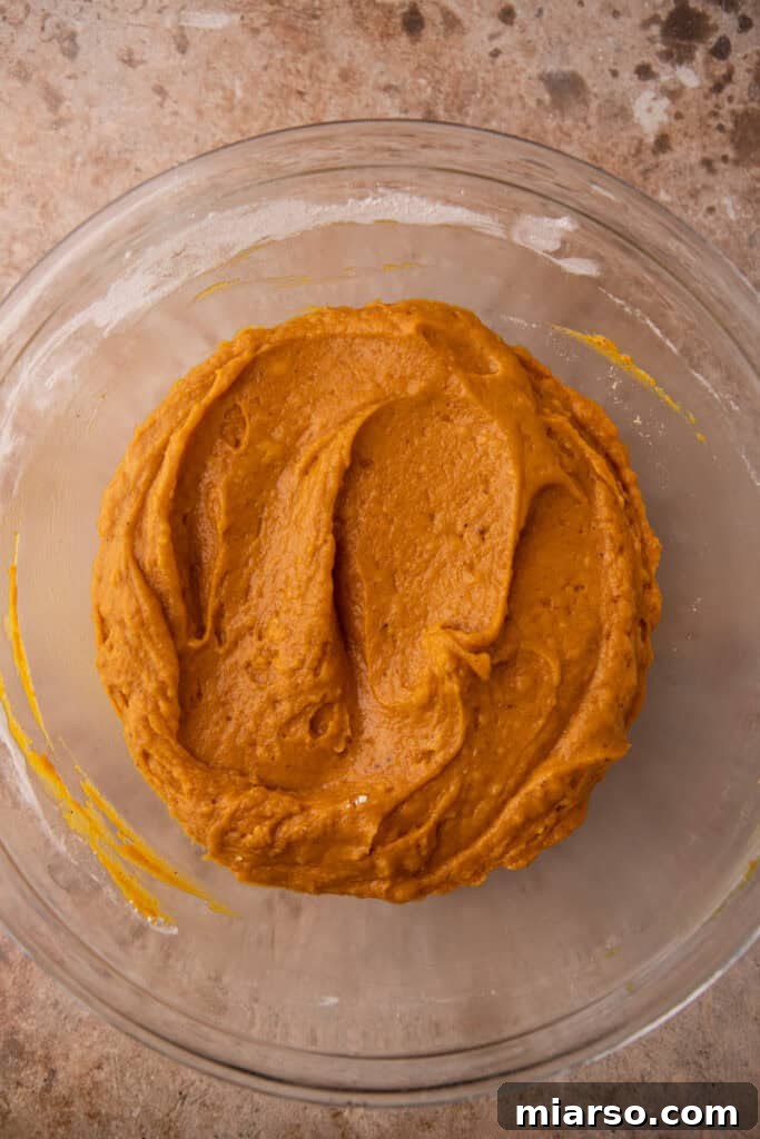 The pumpkin coffee cake batter poured into the prepared baking dish.