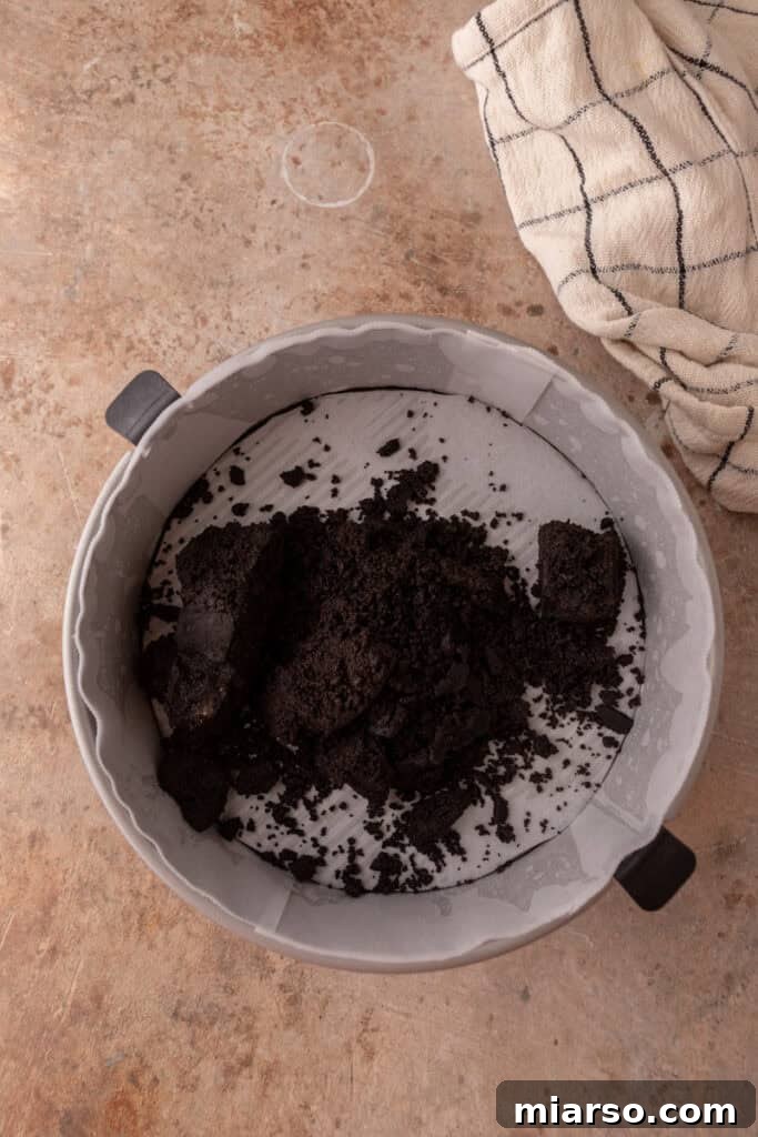 Finely crushed Oreo crumbs ready to be mixed for the cheesecake crust.