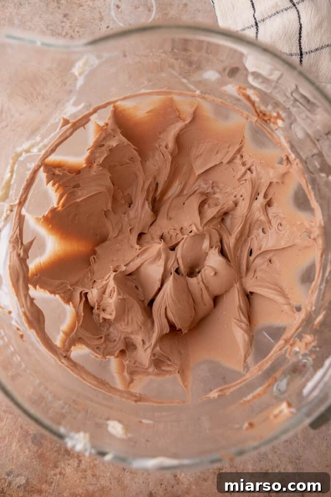 Cream cheese and sugar beaten together until light and fluffy in a mixing bowl.