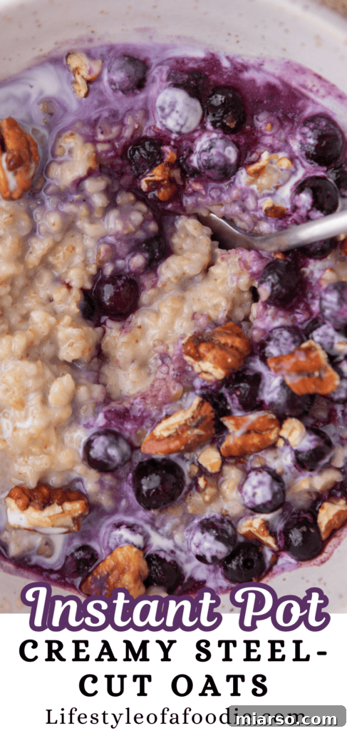 A tall, vertical image of creamy Instant Pot steel-cut oats topped with fresh fruit, perfect for Pinterest.