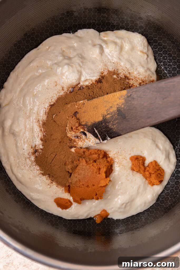 Melted marshmallows and butter in a pot before adding pumpkin and spices.