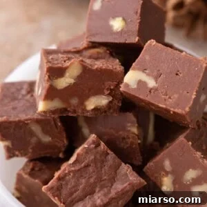 see's candy fudge recipe pieces stacked in a bowl