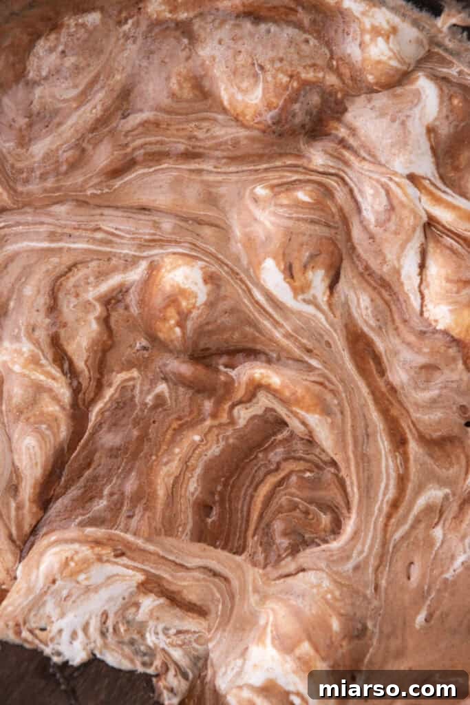 mixed ingredients boiling in a pot, showing the crucial cooking stage for the fudge
