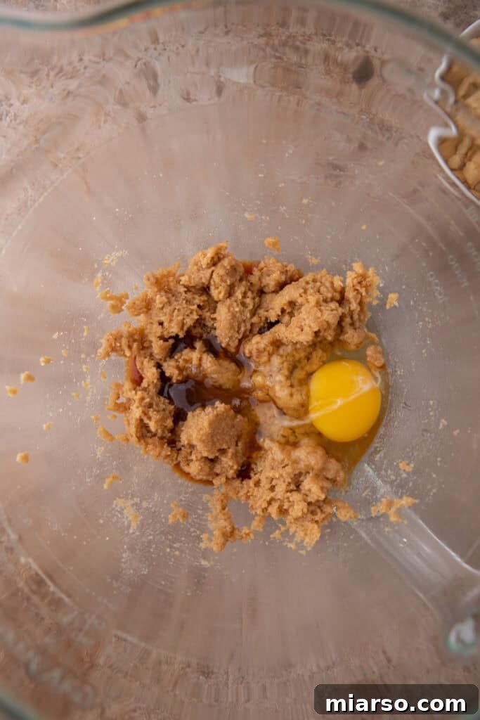 Unmixed dry ingredients in a bowl, ready to be added to the wet mixture.