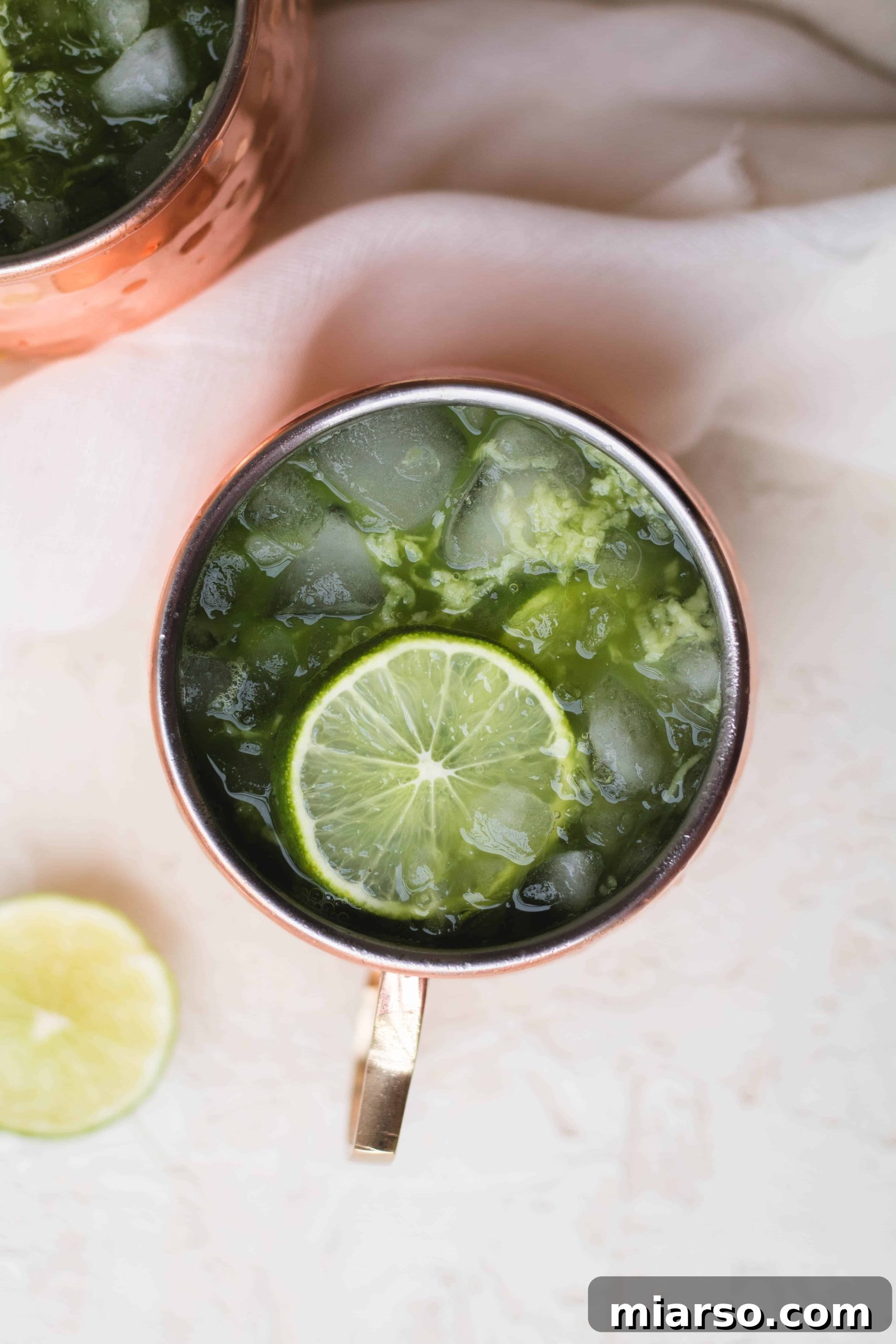 Matcha Virgin Moscow Mule, a refreshing green drink in a copper mug with lime and ginger