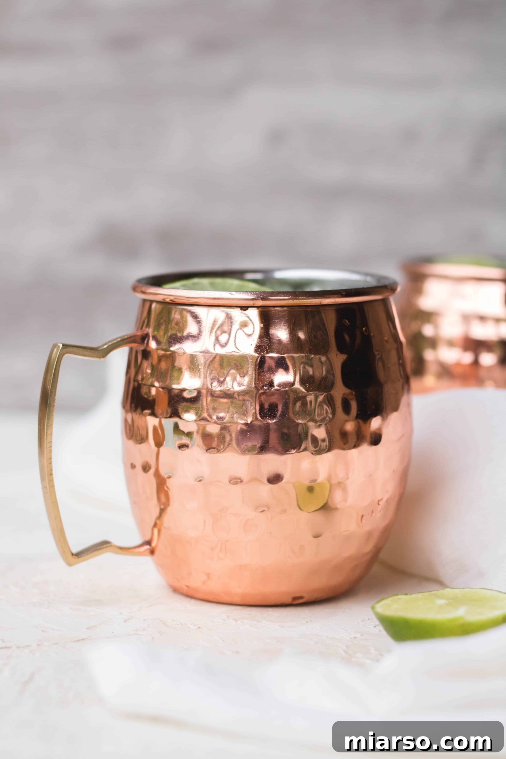 Matcha Virgin Moscow Mule in copper mugs with lime wedges