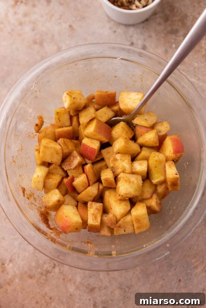 Diced apples thoroughly mixed with lemon juice, brown sugar, cinnamon, nutmeg, and cornstarch.