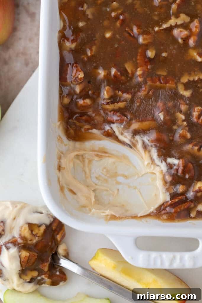 Irresistible Pecan Pie Dip 11 Pecan Pie Dip served in a beautiful dish, surrounded by various dippers like apple slices and graham crackers.
