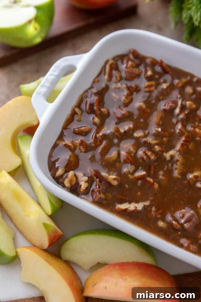 Irresistible Pecan Pie Dip 13 A wide shot of the Pecan Pie Dip in a decorative bowl, inviting guests to enjoy this delicious dessert.