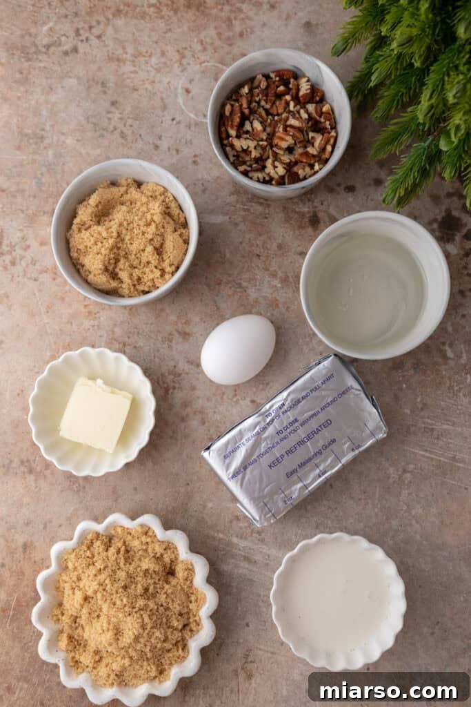 Irresistible Pecan Pie Dip 3 Close-up of all the fresh ingredients laid out for making Pecan Pie Dip, including cream cheese, pecans, brown sugar, and vanilla extract.
