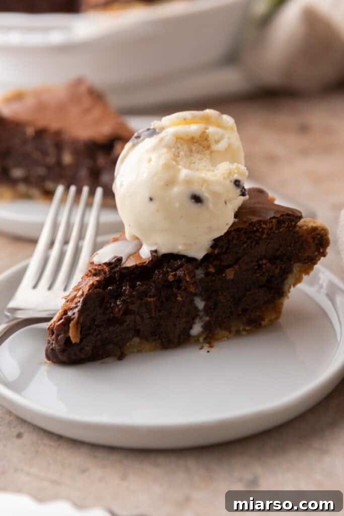 Ultimate Fudgy Brownie Pie 4 brownie pie recipe slice with ice cream on top